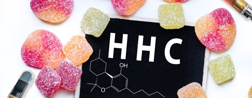 The chemical formula for HHC is pictured next to edibles and vape cartridges.