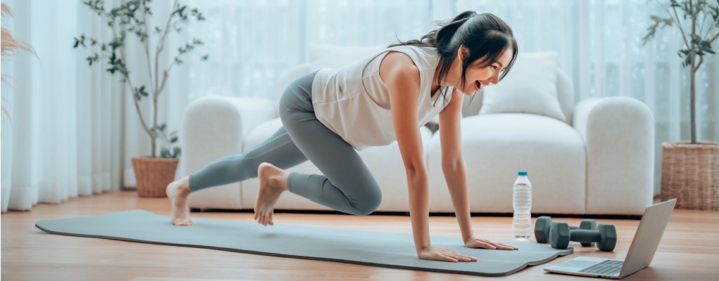 a woman exercises in her living room