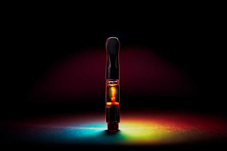 A vape cartridge seen against a black background.