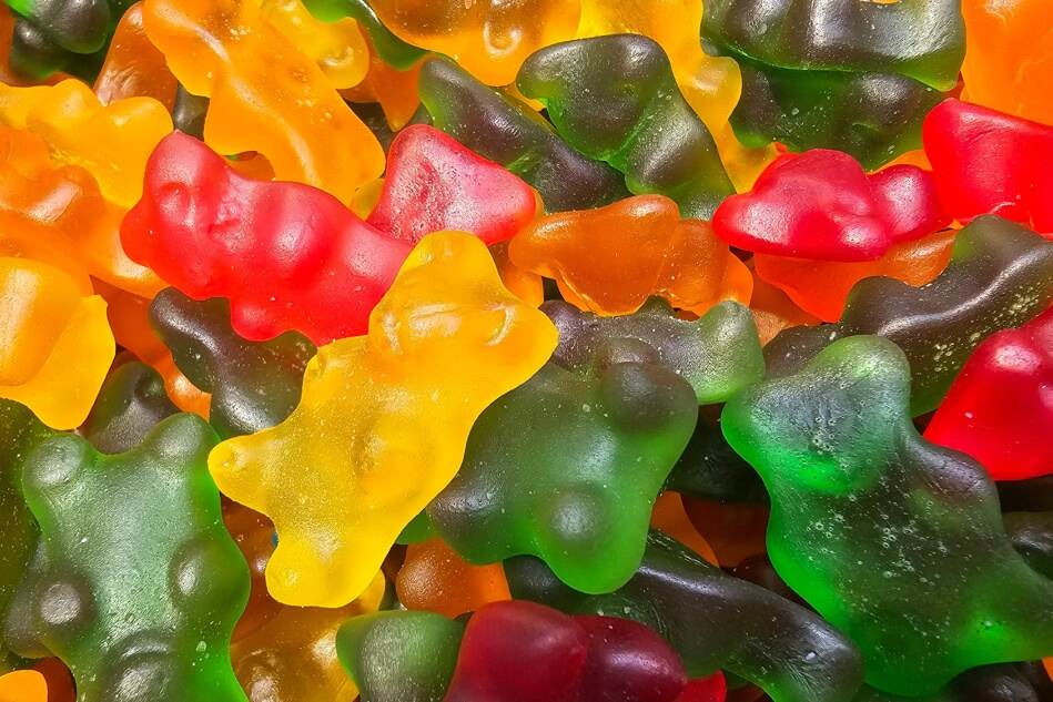 A pile of gummy bears fills the frame.