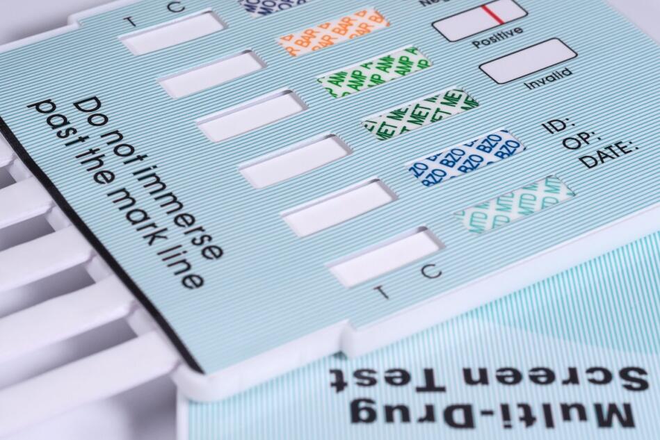A close-up view of a standard urine drug test.