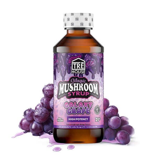 Grape mushroom shots displayed in front of grapes and a white background.