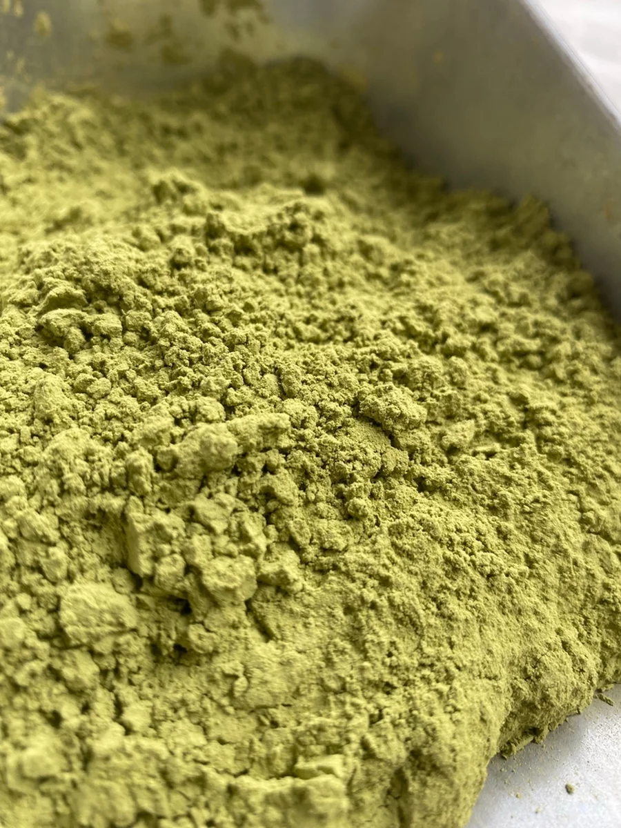 A close-up view of kratom powder in a bowl.