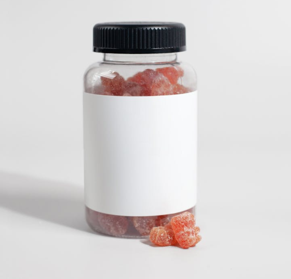 A jar of red gummies showing how long do Delta-8 edibles last.