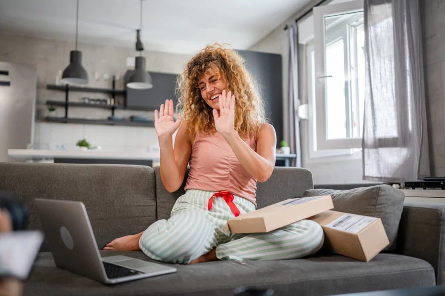 A woman says thank you to a gift giver over video chat.